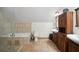 Elegant bathroom features a jetted tub, custom vanity, and tiled flooring at 26348 Se Highway 42, Umatilla, FL 32784