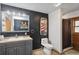 Stylish bathroom with a modern vanity, toilet, and a shower featuring a curtain at 26348 Se Highway 42, Umatilla, FL 32784