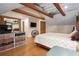 Relaxing bedroom with hardwood floors, a rustic dresser, and a cozy ambiance at 26348 Se Highway 42, Umatilla, FL 32784