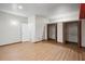 Spacious bedroom with laminate flooring, two closets, and two doors leading to other parts of the house at 26348 Se Highway 42, Umatilla, FL 32784
