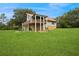 Spacious home with large lawn, stone accents, and multiple balconies for enjoying the scenic views at 26348 Se Highway 42, Umatilla, FL 32784