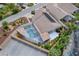 Aerial view of home featuring solar panels and screened-in pool at 3114 Jemima Ave, The Villages, FL 32163