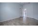 Light and airy bedroom with light grey wood floors at 3114 Jemima Ave, The Villages, FL 32163