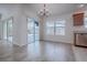 Dining area with hardwood floors, chandelier, and sliding glass doors to the screened-in pool at 3114 Jemima Ave, The Villages, FL 32163