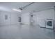Large three car garage with epoxy flooring and new washer and dryer at 3114 Jemima Ave, The Villages, FL 32163