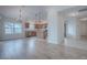 Bright kitchen features wood cabinets, stainless steel appliances, pendant lighting, and an island at 3114 Jemima Ave, The Villages, FL 32163