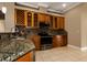 Updated kitchen with granite countertops, stainless steel appliances, and ample cabinet space at 27303 Gingerbread Pl, Leesburg, FL 34748