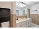 Bathroom with double vanity and updated fixtures at 11635 Se Highway 42, Weirsdale, FL 32195