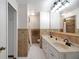 Clean bathroom with double vanity, shower, and updated fixtures at 11635 Se Highway 42, Weirsdale, FL 32195