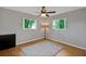 Bright bedroom with hardwood floors and ceiling fan at 11635 Se Highway 42, Weirsdale, FL 32195