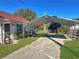 Metal carport providing covered parking at 11635 Se Highway 42, Weirsdale, FL 32195