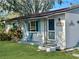 House exterior with a green lawn and porch at 11635 Se Highway 42, Weirsdale, FL 32195