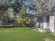 Charming house with a spacious green lawn and mature trees at 11635 Se Highway 42, Weirsdale, FL 32195