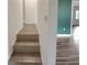 Tiled stairs leading to upper level at 11635 Se Highway 42, Weirsdale, FL 32195