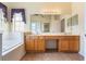 Primary bathroom offers a double sink vanity, soaking tub, and tile flooring at 3506 Mulberry Grove Loop, Leesburg, FL 34748