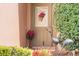 Close-up of a beautifully adorned front door with decorative accents and a welcoming entrance at 3506 Mulberry Grove Loop, Leesburg, FL 34748