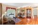 Comfortable living room with wood floors and ample natural light at 3506 Mulberry Grove Loop, Leesburg, FL 34748