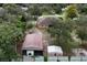 Aerial view showcasing a house, detached garage, and workshop at 15921 Hanson View Dr, Tavares, FL 32778