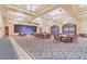 Large ballroom with elegant chandeliers, tables, and chairs at 27227 Roanoke Dr, Leesburg, FL 34748