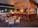A cozy bar with a handsome wood bar, comfortable seating, and a wide selection of drinks at 27227 Roanoke Dr, Leesburg, FL 34748