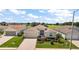 Charming single-story home with well-manicured landscaping and a two-car garage at 27227 Roanoke Dr, Leesburg, FL 34748