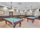 Game room featuring multiple pool tables and decorative lighting at 27227 Roanoke Dr, Leesburg, FL 34748