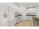 The kitchen features white appliances and lots of cabinet storage at 27227 Roanoke Dr, Leesburg, FL 34748