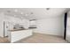Modern kitchen with white cabinetry, stainless steel appliances and hardwood floors at 27227 Roanoke Dr, Leesburg, FL 34748