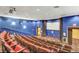 Home theater with comfortable seating and a large screen at 27227 Roanoke Dr, Leesburg, FL 34748