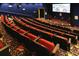 Private movie theater with tiered seating, a large screen, and atmospheric lighting at 27227 Roanoke Dr, Leesburg, FL 34748