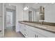 Bright bathroom featuring double sinks, modern lighting, and a large mirror for a luxurious feel at 3106 Voyager Ave, St Cloud, FL 34771