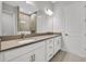 Modern bathroom with double vanity, walk-in shower, and tile flooring provides a luxurious feel at 3106 Voyager Ave, St Cloud, FL 34771