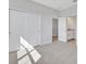Neutral bedroom with carpeted floors, closet, and connecting bathroom creating a serene and private retreat at 3106 Voyager Ave, St Cloud, FL 34771