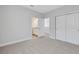Spacious bedroom with soft carpeting, large closet, and en-suite bathroom, perfect for relaxation and privacy at 3106 Voyager Ave, St Cloud, FL 34771