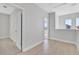 Hallway with hard wood floors, white walls, and white doors at 3106 Voyager Ave, St Cloud, FL 34771