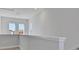 Hallway with hard wood floors, white walls, white trim, and multiple windows at 3106 Voyager Ave, St Cloud, FL 34771
