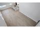 Open concept kitchen with island, hard wood floors, stainless steel appliances and white cabinets at 3106 Voyager Ave, St Cloud, FL 34771