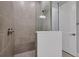 Modern walk-in shower with tile walls and glass door creates a spa-like experience at 3106 Voyager Ave, St Cloud, FL 34771