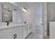Modern bathroom featuring double vanity, granite countertop, and tiled shower at 6521 Daypack Ln, St Cloud, FL 34771