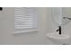 Powder room with vessel sink, modern faucet, and round mirror at 6521 Daypack Ln, St Cloud, FL 34771