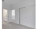 Spacious bedroom with an ensuite bathroom, and features neutral carpet, and a closet with sliding doors at 6521 Daypack Ln, St Cloud, FL 34771