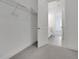 Bedroom with walk in closet and carpet flooring at 6521 Daypack Ln, St Cloud, FL 34771