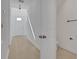 Bright hallway features wood flooring, white walls, and access to the bathroom at 6521 Daypack Ln, St Cloud, FL 34771