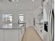 Spacious kitchen island featuring modern appliances and bright countertops at 6521 Daypack Ln, St Cloud, FL 34771