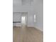 Open-concept living area with neutral walls and wood flooring at 6521 Daypack Ln, St Cloud, FL 34771