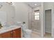 Bathroom with shower, toilet, vanity, and linen closet at 668 Maybank Loop, The Villages, FL 32162