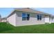 Exterior view highlighting the home's backyard and architectural details at 191 Bottle Brush Dr, Haines City, FL 33844