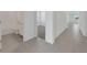 Bathroom view with a white tiled shower and gray tile floor at 191 Bottle Brush Dr, Haines City, FL 33844