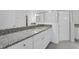 Bathroom vanity featuring granite countertops and framed shower with glass door at 191 Bottle Brush Dr, Haines City, FL 33844