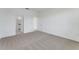 Spacious bedroom with plush carpet and natural light at 191 Bottle Brush Dr, Haines City, FL 33844